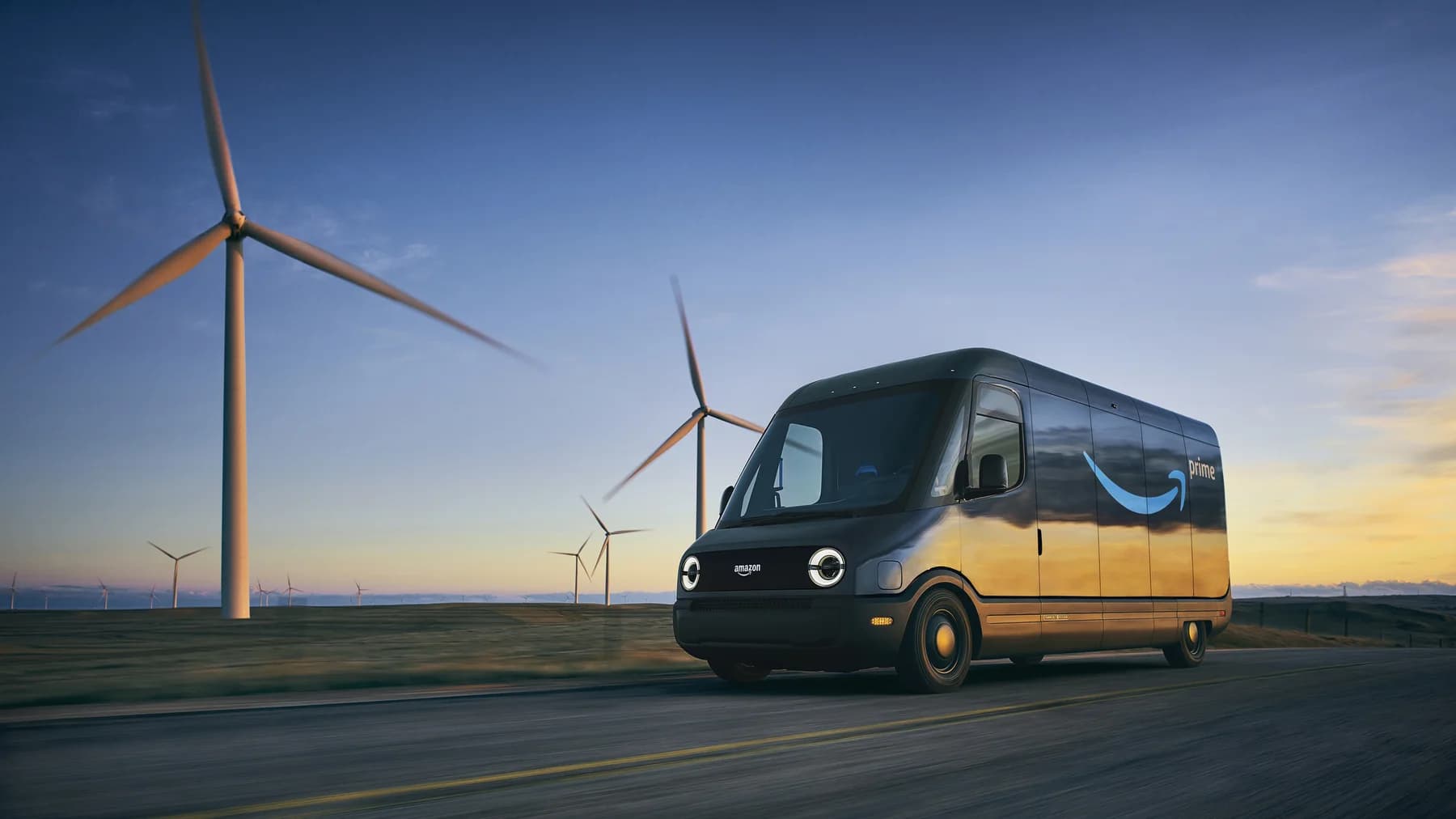 Amazon Prime electric delivery van traveling past wind turbines